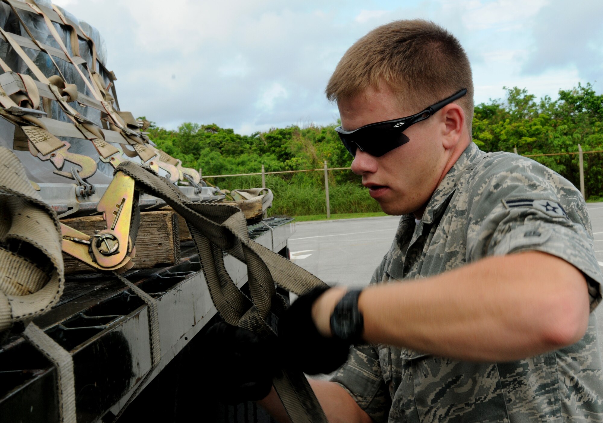 Airman 1st Class Brian Bushey, 18th Logistics Readiness Squadron vehicle operator, locks a few pallets together on a multi-pallet train to place a boom assembly for cargo shipping July 12 during Beverly High 11-5, a Local Operational Readiness Exercise at Kadena Air Base, Japan. The 18th Wing is participating in the LORE July 11-13 to test the readiness of Kadena Airmen.  (U.S. Air Force photo/Airman 1st Class Jarvie Z. Wallace)
