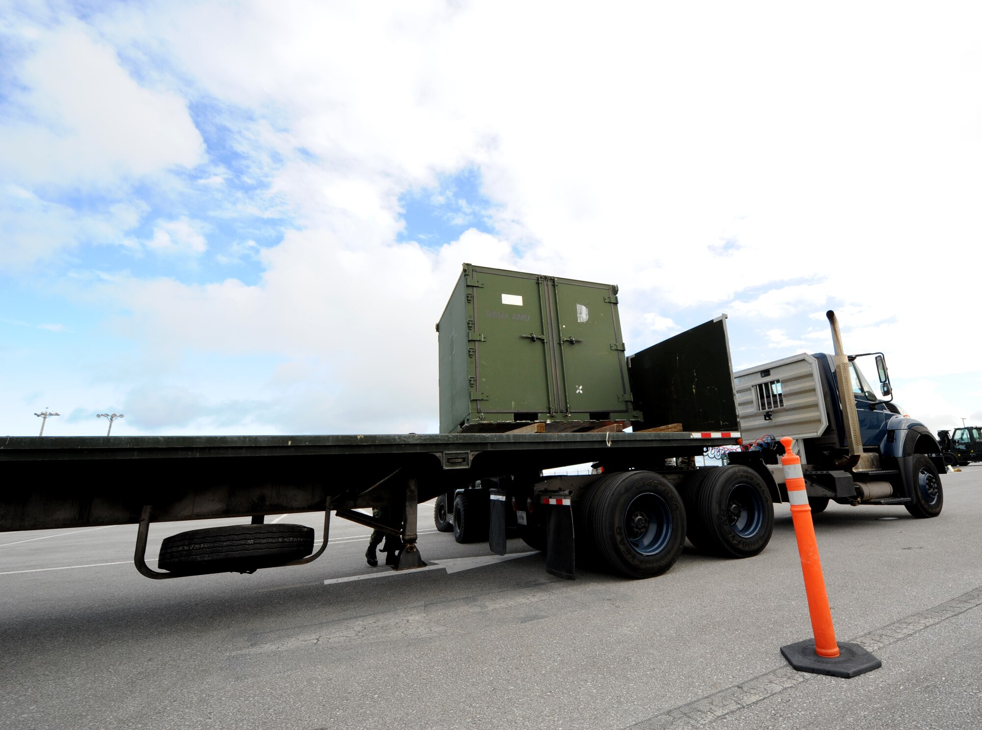 A truck carries a cargo shipment July 12 during Beverly High 11-5, a Local Operational Readiness Exercise at Kadena Air Base, Japan. The 18th Wing is participating in the LORE July 11-13 to test the readiness of Kadena Airmen. (U.S. Air Force photo/Airman 1st Class Jarvie Z. Wallace) 
