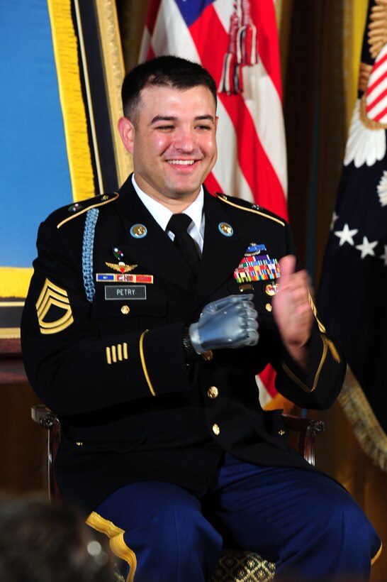 Army Sgt. 1st Class Leroy Arthur Petry applauds during a ceremony at the White House in Washington, D.C. on July 12, 2011. 