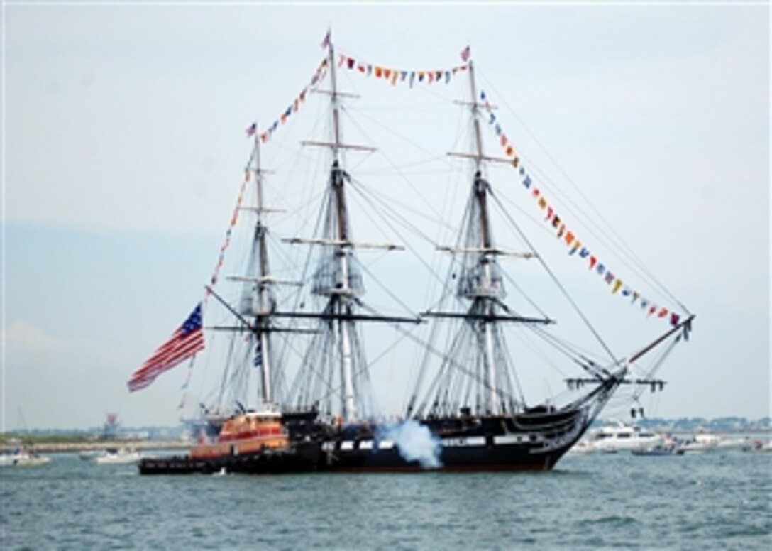 The USS Constitution fires a 21-gun salute toward Fort Independence on Castle Island during the ship's annual under way in Boston Harbor on July 4, 2011.  The Boston Harborfest is a six-day festival showcasing Boston's Colonial and maritime heritage.  First launched in 1797, Constitution, also known as "Old Ironsides," was one of six ships ordered for construction by President George Washington to protect America's growing maritime interests and is the oldest commissioned warship afloat in the world.  