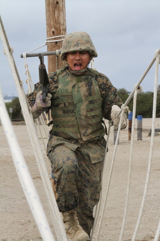 The sounds of gun fire and screaming filled the air as fully geared-up recruits from Company G, Marine Corps Recruit Depot San Diego, Calif., attacked the bayonet assault course July 12 with M-16A2 service rifles in hand.