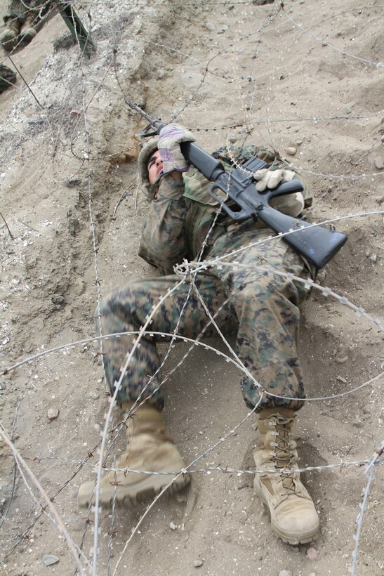 The sounds of gun fire and screaming filled the air as fully geared-up recruits from Company G, Marine Corps Recruit Depot San Diego, Calif., attacked the bayonet assault course July 12 with M-16A2 service rifles in hand.