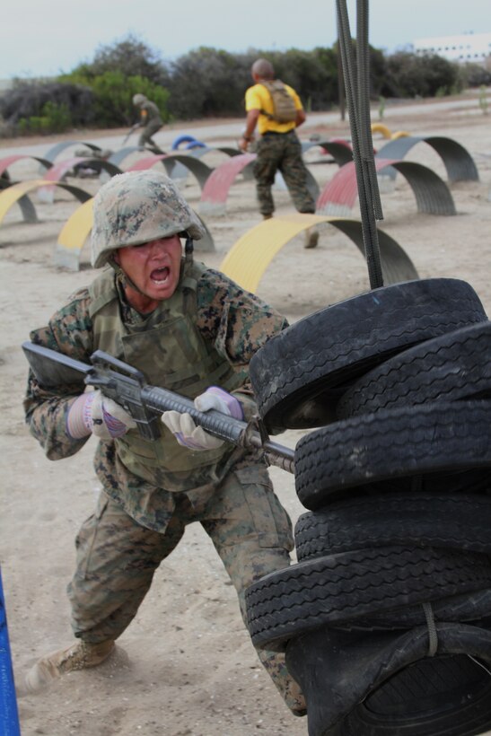 The sounds of gun fire and screaming filled the air as fully geared-up recruits from Company G, Marine Corps Recruit Depot San Diego, Calif., attacked the bayonet assault course July 12 with M-16A2 service rifles in hand.