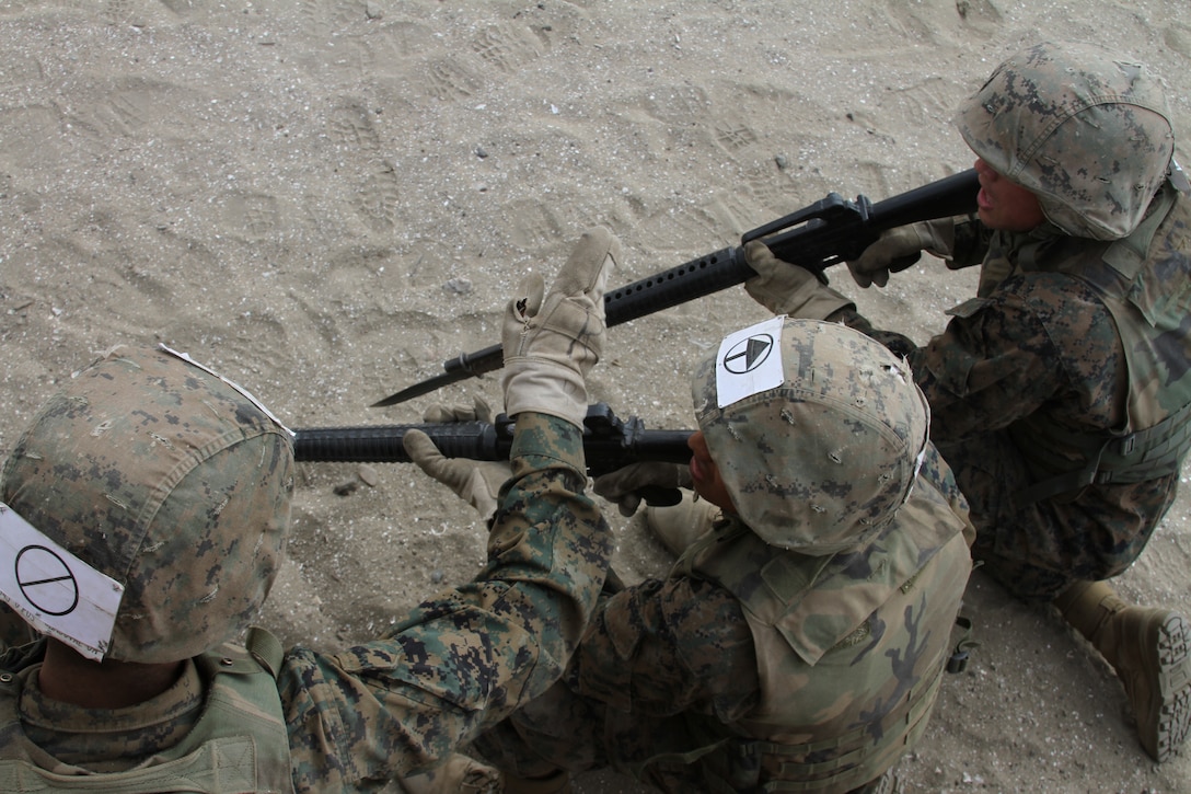 The sounds of gun fire and screaming filled the air as fully geared-up recruits from Company G, Marine Corps Recruit Depot San Diego, Calif., attacked the bayonet assault course July 12 with M-16A2 service rifles in hand.
