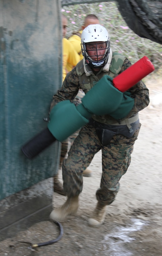 The sounds of gun fire and screaming filled the air as fully geared-up recruits from Company G, Marine Corps Recruit Depot San Diego, Calif., attacked the bayonet assault course July 12 with M-16A2 service rifles in hand.