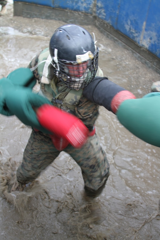 The sounds of gun fire and screaming filled the air as fully geared-up recruits from Company G, Marine Corps Recruit Depot San Diego, Calif., attacked the bayonet assault course July 12 with M-16A2 service rifles in hand.