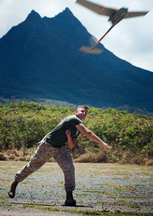 Lance Cpl. Andrew Donnelley, a team leader with Kilo Company, 3rd Battalion, 3rd Marine Regiment, launches an RQ-11B Raven unmanned aircraft system during UAS flight operations at Marine Corps Training Area Bellows, Hawaii, July 12, 2011. Flying between 300 and 1,000 feet over MCTAB, the Raven’s cameras collected real-time video of the training area, recording the information through the laptop. In only a few short months, Donnelley and his fellow 3/3 Marines will use the Raven in Afghanistan to gather intelligence, allowing battalion leaders to analyze and use the information for reconnaissance, surveillance and target acquisition.