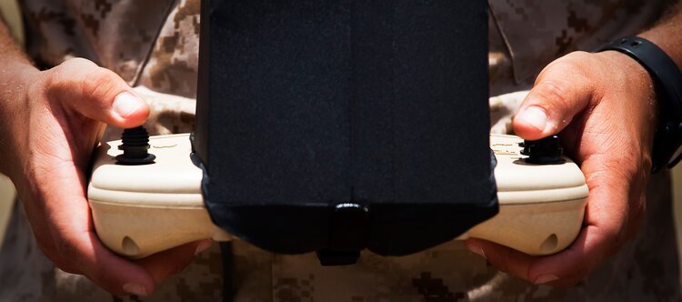 Lance Cpl. Michael Cuneo, a rifleman with India Company, 3rd Battalion, 3rd Marine Regiment, uses a directional pad to control an RQ-11B Raven unmanned aircraft system during UAS flight operations at Marine Corps Training Area Bellows, Hawaii, July 12, 2011. Though Cuneo specializes as a rifleman, his grip has temporarily transferred from his rifle to the controls of the Raven. During 3/3’s upcoming fall deployment to Afghanistan, Cuneo, from Newcastle, Calif., will fulfill duties as a company-level intelligence cell Marine for India Co. “Gathering intelligence makes an impact on a daily basis,” Cuneo said. “If I can gather intelligence for my squad and send it up to higher, I can make an impact at a larger level than just in my squad’s area of operation.”