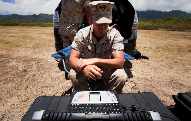 Lance Cpl. Chance Voth, an ammunition man with Lima Company, 3rd Battalion, 3rd Marine Regiment, uses a laptop to track the movement of an RQ-11B Raven unmanned aircraft system during UAS flight operations at Marine Corps Training Area Bellows, Hawaii, July 12, 2011. Flying between 300 and 1,000 feet over MCTAB, the Raven’s cameras collected real-time video of the training area, recording the information through the laptop. In only a few short months, the 3/3 Marines will use the Raven in Afghanistan to gather intelligence, allowing battalion leaders to analyze and use the information for reconnaissance, surveillance and target acquisition.