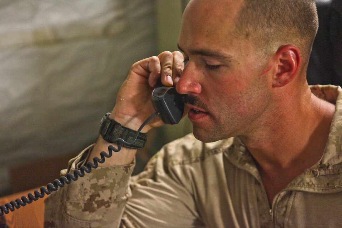 Pittsburgh native Cpl. Zachary Beamer bares the scar by his left ear where shrapnel from an Improvised Explosive Device recently hit his face.  The assaultman with 2nd Battalion, 8th Marine Regiment, spent only two weeks in recovery for injuries across his left arm and torso before returning to his unit.