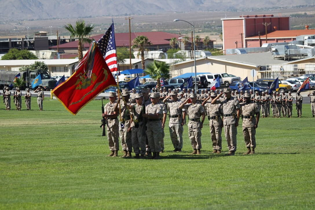 The battalion renders honors as the National Anthem plays during the 3rd Battalion, 11th Marine Regiment, change of command ceremony at Lance Cpl. Torrey L. Gray Field July 13, 2011.::r::::n::