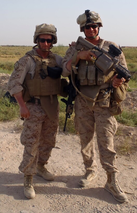 Navy Lt. Robert M. Hess (left), from Philadelphia, the chaplain for Combat Logistics Battalion 7, 2nd Marine Logistics Group (Forward) and Petty Officer 2nd Class Ian S. Kast (right), from Bliss, Idaho, a religious program specialist with the battalion, pose for a picture July 14, 2011, in Marjah, Afghanistan.  As the battalion's chaplain, Hess travels around to the different combat outposts and forward operating bases to visit the Marines and sailors of the battalion.  He conducts a monthly marriage and family class for the young Marines, to help them cope with deployment issues. (Courtesy picture)