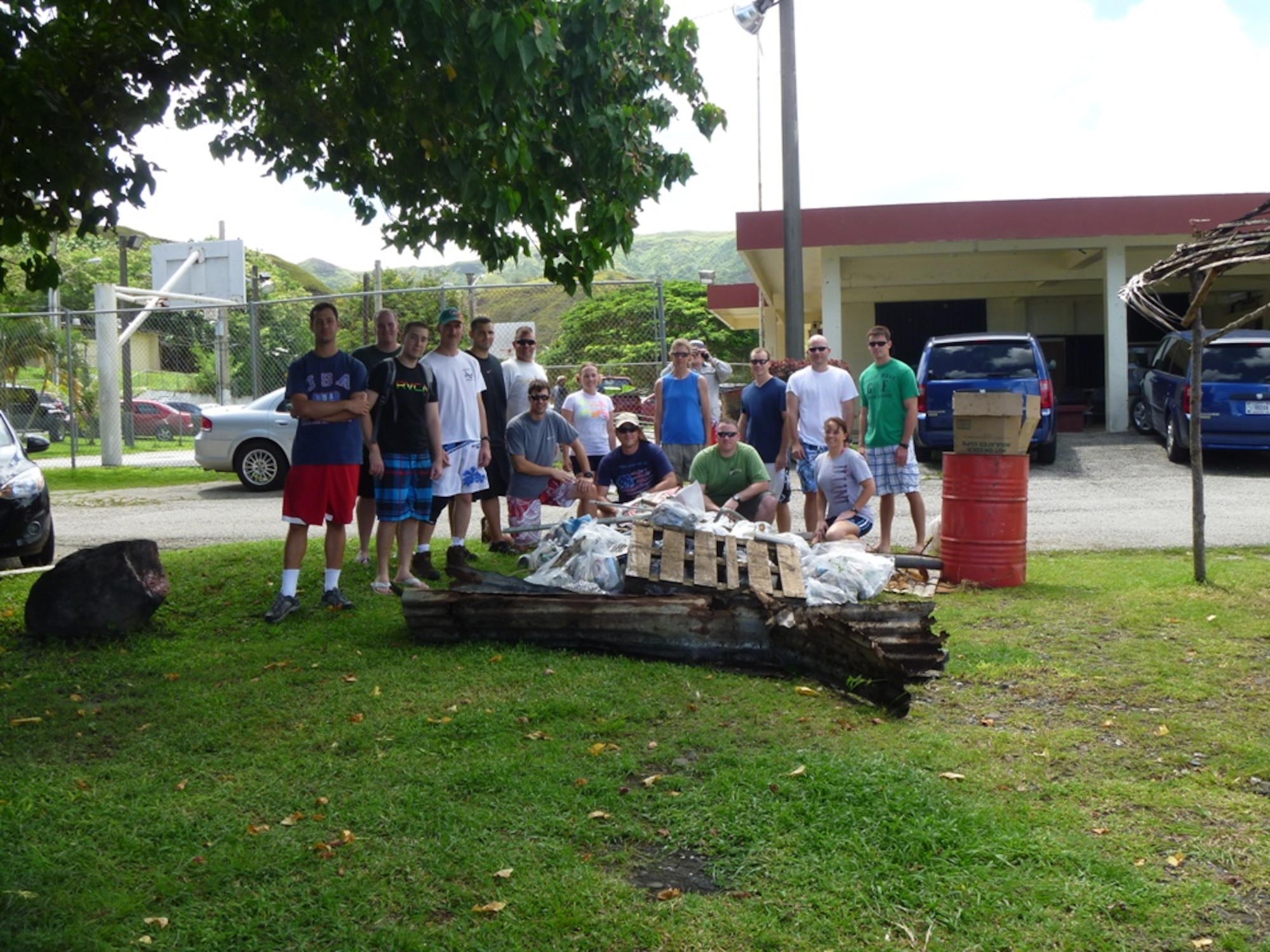 Since their arrival in April, members of the 96th Expeditionary Bomb Squadron began to improve the quality and safety of surrounding beaches by cleaning up garbage, debris and goods discarded after barbecues. Here, the unit poses with the day's collection. (U.S. Air Force Courtesy Photo)