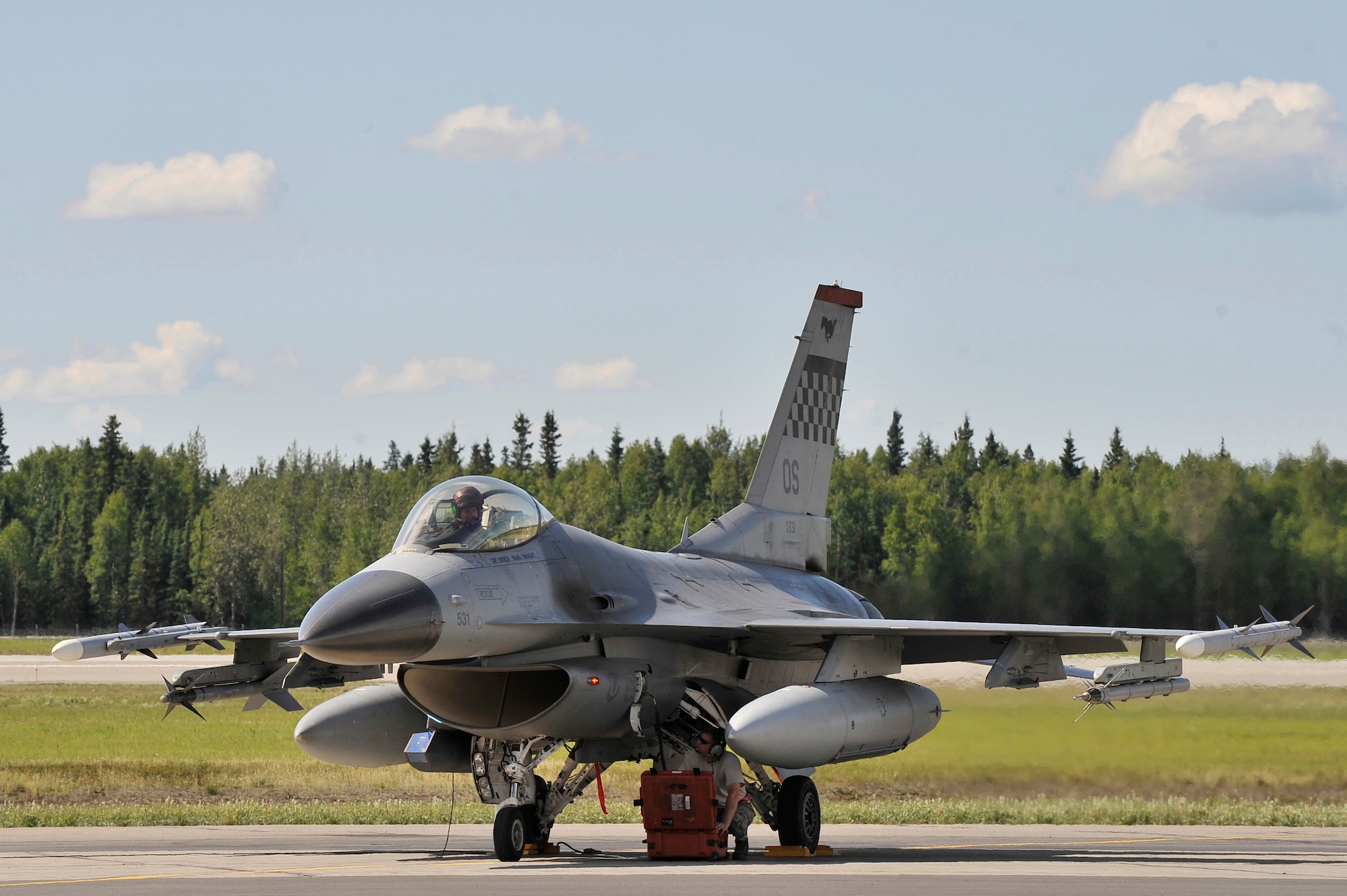 An F-16 Fighting Falcon is prepared for shutdown after completing a familiarization flight July 6, 2011, Eielson Air Force Base, Alaska. The F-16 is assigned to the 36th Fighter Squadron, Osan Air Base, Republic of Korea. The 36th FS is participating in RED FLAG-Alaska 11-2, a two week long exercise providing aircrew realistic combat sorties, increasing their chances of survival in combat. (U.S. Air Force photo/Staff Sgt. Christopher Boitz)