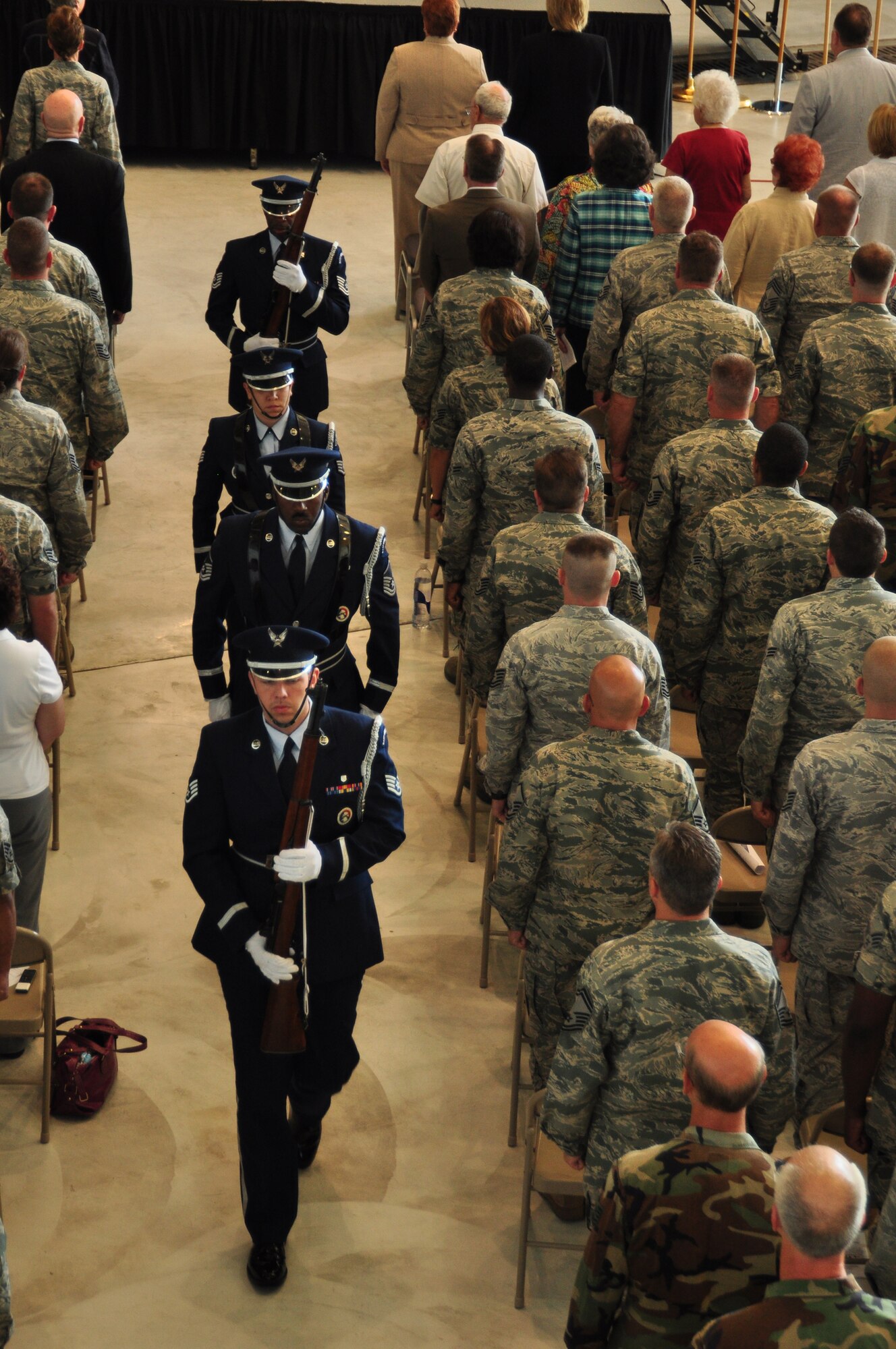 WRIGHT-PATTERSON AIR FORCE BASE, Ohio – The 445th Airlift Wing's Honor Guard marches down the aisle at the start of the Wing’s C-17 Welcome Ceremony July 9. More than 600 people attended the event which included featured speakers David Hobson, former U.S. Representative Ohio’s 7th District, Lt. Gen. Charles Stenner Jr., Air Force Reserve Command commander, retired Brig. Gen. Howard Ingersoll, the Boeing Company representative, and Col. Stephen Goeman, 445th Airlift Wing commander. (U.S. Air Force photo/Senior Airman Mikhail Berlin)