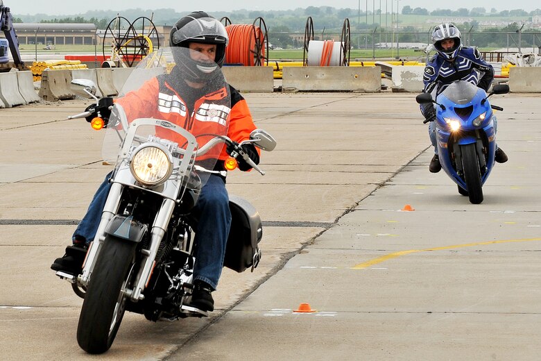 U.S. Air Force Brig. Gen. Donald Bacon, 55th Wing commander, weaves through cones during the Basic Riders Course 2 motorcycle training class in the Air Force Weather Agency parking lot on Offutt Air Force Base, Neb., on July 7. 

(U.S. Air Force Photo by Charles Haymond/Released)
