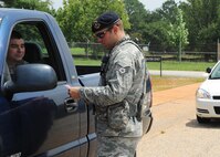 U.S. Air Force Staff Sgt. Adam Sacchetti, 20th Security Forces Squadron patrolman, pulls over another Airman at Shaw Air Force Base, S.C., to enforce regulations, such as speed limit and seatbelt usage July 12, 2012. The 20th SFS provide and enforce protection for Airmen of Shaw and its assets. (U.S. Air Force photo/Airman 1st Class Tabatha L. Duarte) (Released) 