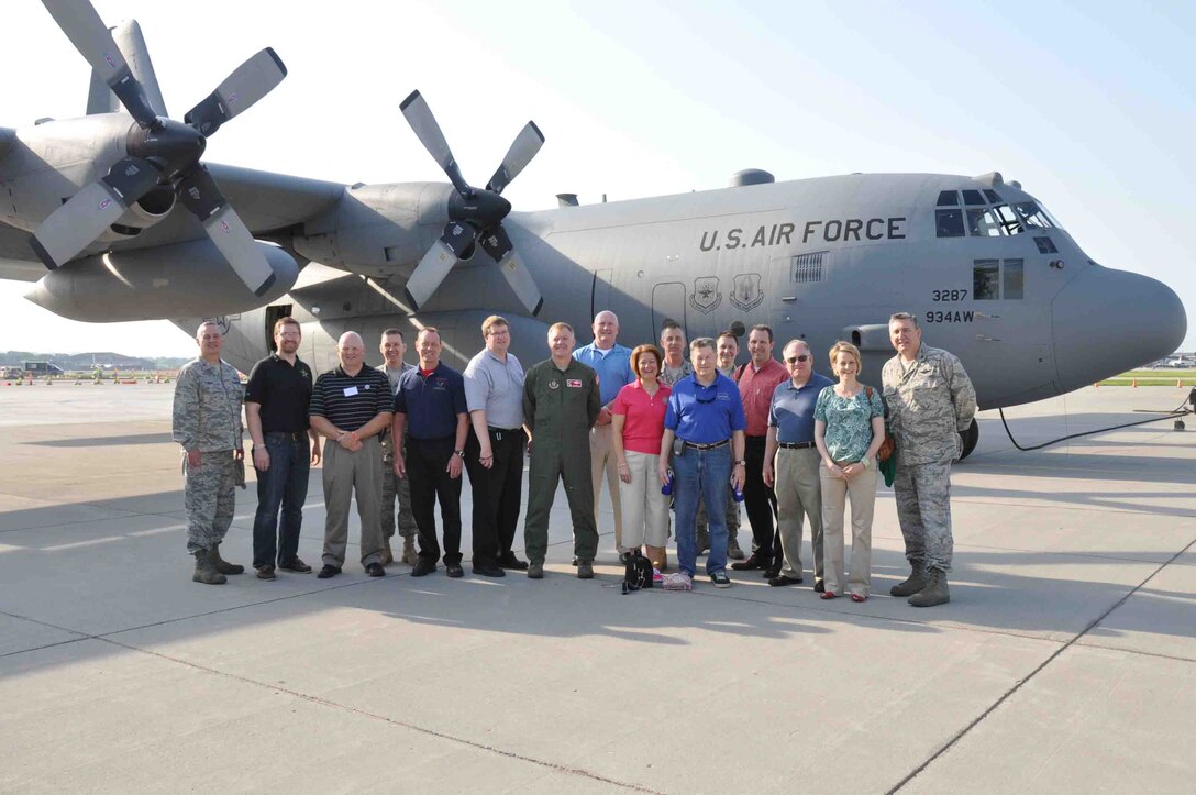 Bob Hawkins, 934th Security Forces Squadron honorary commander gets a look at the flight deck of a 934th Airlift Wing C-130 during the honorary commanders orientation flight June 30. (Air Force Photo/Paul Zadach)