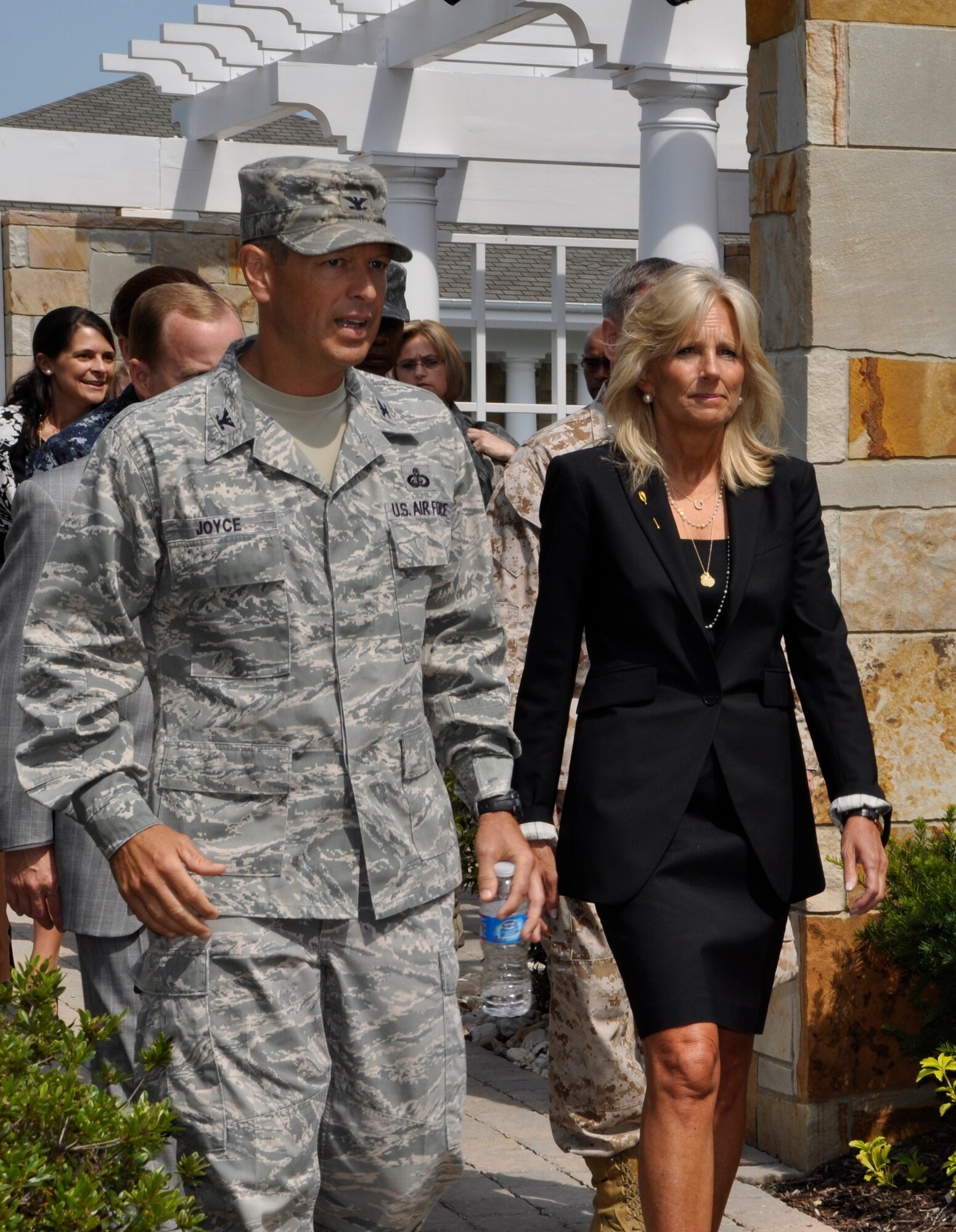 Air Force Col. Thomas C. Joyce, Air Force Mortuary Affairs commander, gives Dr. Jill Biden, wife of Vice President Joe Biden, a tour of the Campus for Families of the Fallen at Dover Air Force Base, Del., July 13, 2011. More than 5,000 family members have attended the dignified transfer of a loved one. Approximately 600 family members have stayed at the Fisher House since it opened in December. (U.S. Air Force photo/Christin Michaud)