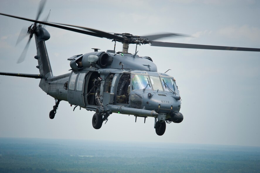 An HH-60G Pave Hawk flown by Col. Gary Henderson, 23rd Wing commander, flies over the skies of the Grand Bay Bombing and Gunnery Range during a training mission with the 41st Rescue Squadron, July 12, 2011. The flight also served as part of Henderson’s fini-flight before departing the wing for Ramstein Air Base, Germany. (U.S. Air Force photo by Staff Sgt. Jamal D. Sutter/Released) 