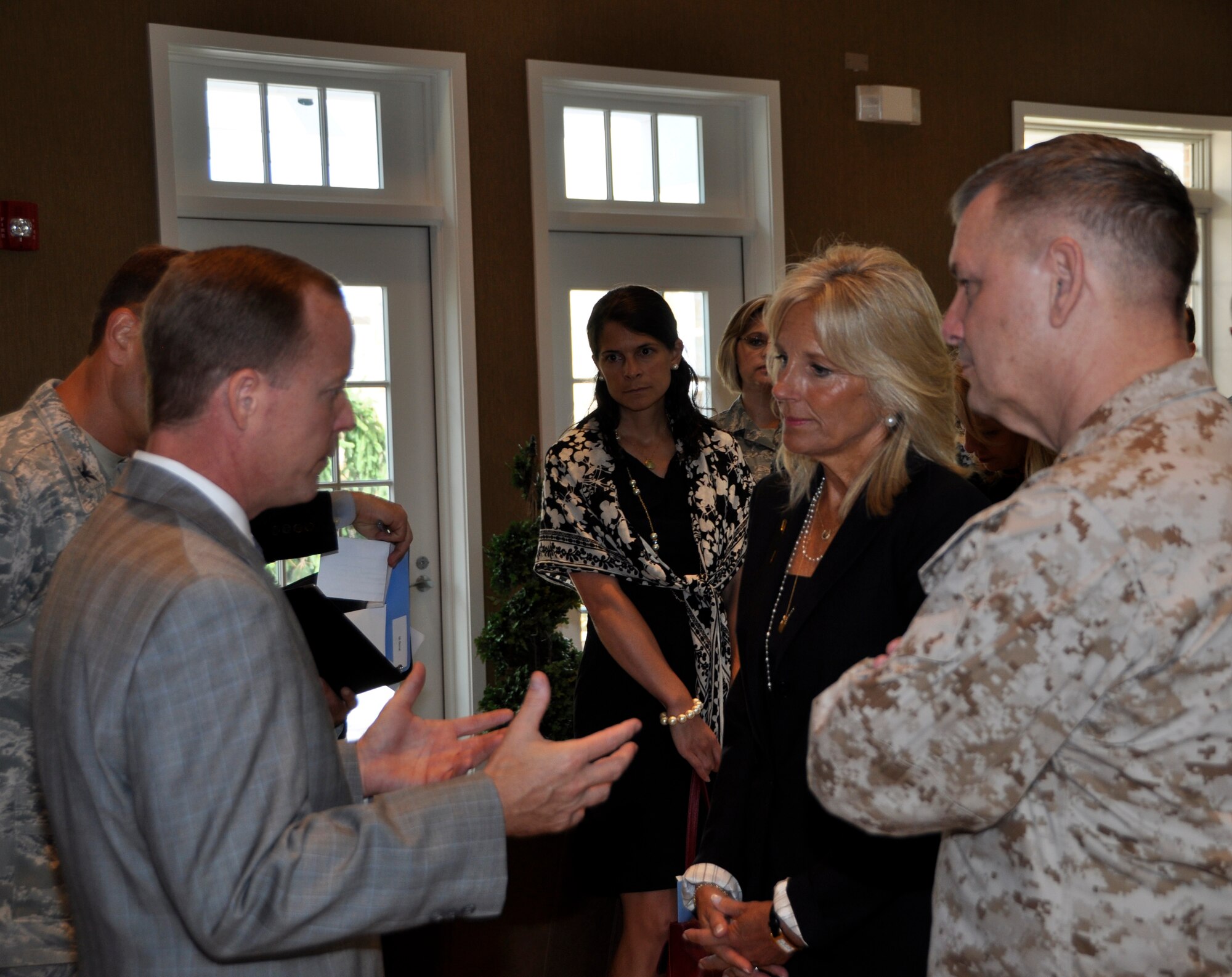 Todd Rose, (left) Mortuary Affairs Division director, shares the Fisher House Foundation’s vision with Vice Chairman of the Joint Chiefs of Staff Gen. James E. Cartwright and Jill Biden, wife of Vice President Joe Biden, in the Meditation Pavilion of the Campus for Families of the Fallen at Dover Air Force Base, Del., July 13, 2011. Cartwright and Biden toured the Fisher House, Meditation Pavilion and Center for Families of the Fallen. More than 5,000 family members have traveled to Dover to witness the dignified transfer of their loved one. (U.S. Air Force photo/Christin Michaud)