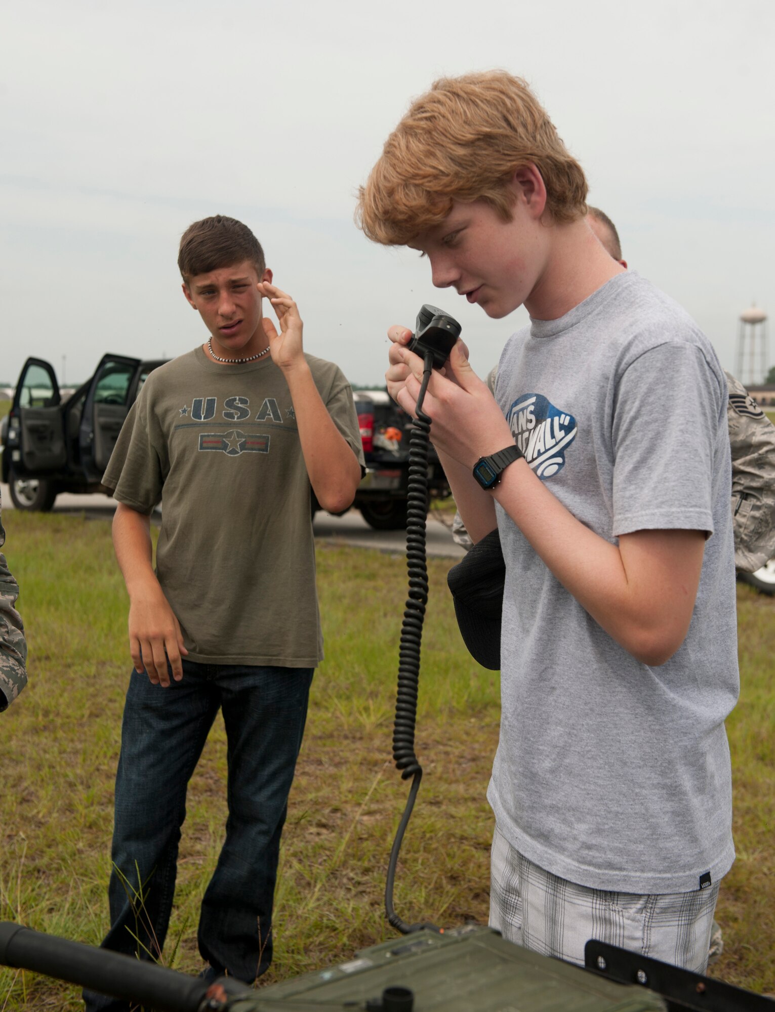 U.S. Air Force Civil Air Patrol member Scott Moker looks on as Calvin Henderson, son of Col. Gary Henderson, 23rd Wing commander, gives the cue to start the tandem jump for his father’s final flight at Moody Air Force Base, Ga., July 12, 2011. Moker helped set up the landing site for Colonel Henderson. (U.S. Air Force photo by Airman 1st Class Joshua Green/Released)
