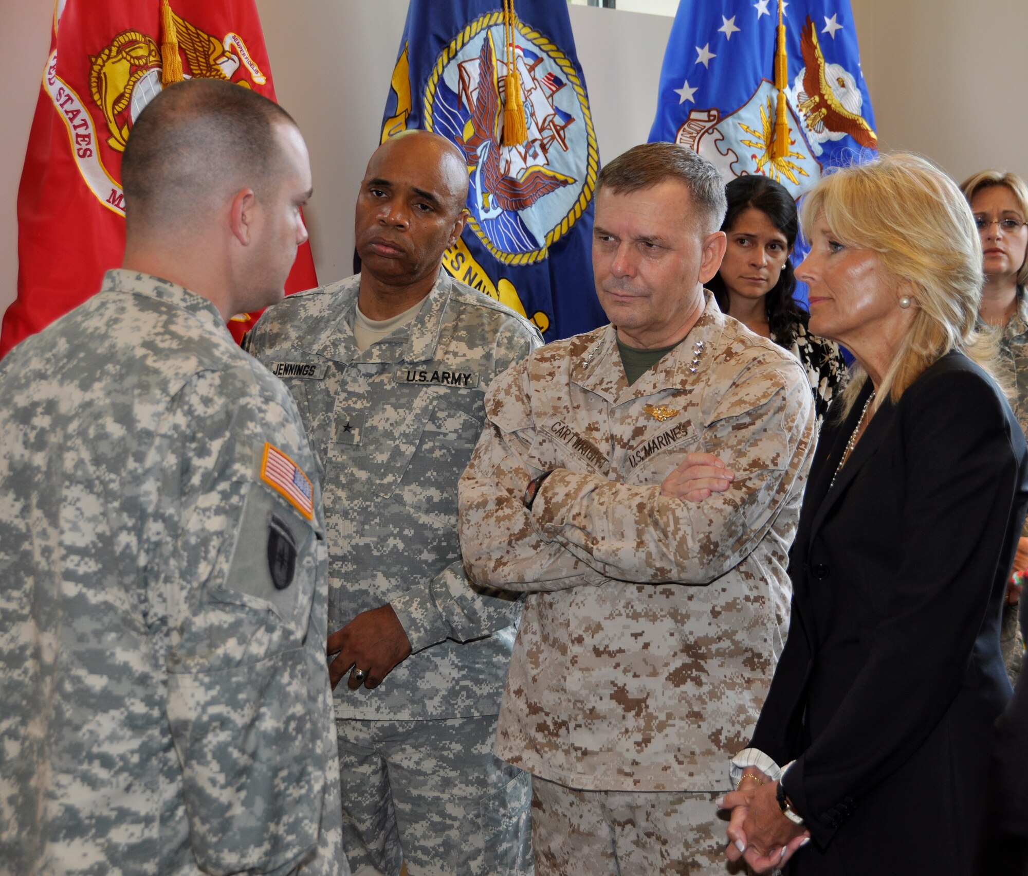 Army Brig. Gen. Leodis T. Jennings, Special Assistant to the Deputy Chief of Staff G-8, Marine Gen. James E. Cartwright, Vice Chairman of the Joint Chiefs of Staff and Jill Biden, wife of Vice President Joe Biden, listen as Army Sgt. 1st Class James S. Carroll, a casualty assistance officer, briefs them before they meet with the family of a fallen soldier at the Center for the Families of the Fallen at Dover Air Force Base, Del., July 13, 2011. (U.S. Air Force photo/Christin Michaud)