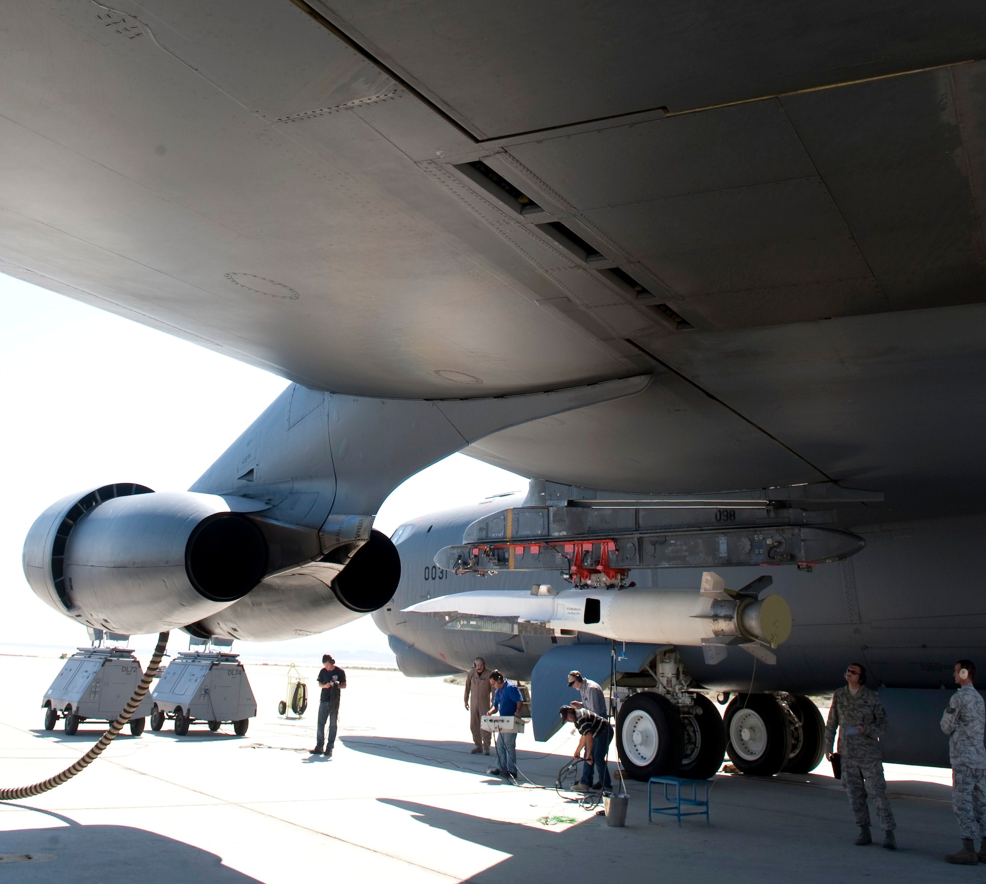 Members of the Hypersonics Combined Test Force and the 419th Flight Test Squadron make final preparations to the X-51A Waverider scramjet before its second test flight June 13. More than 100 people from both Team Edwards and Naval Air Station Point Mugu took part in the enormously complex flight test. (Photo by Bob Ferguson/Boeing)