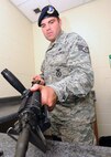 U.S. Air Force Staff Sgt. Adam Sacchetti, 20th Security Forces Squadron patrolman, cleans his M-4 carbine rifle at the security forces squadron at Shaw Air Force Base, S.C., July 12, 2011. The 20th SFS Airmen are required to clean their weapon twice a month to ensure accuracy and prevent weapon malfunction. (U.S. Air Force photo/Airman 1st Class Tabatha L. Duarte) (Released) 