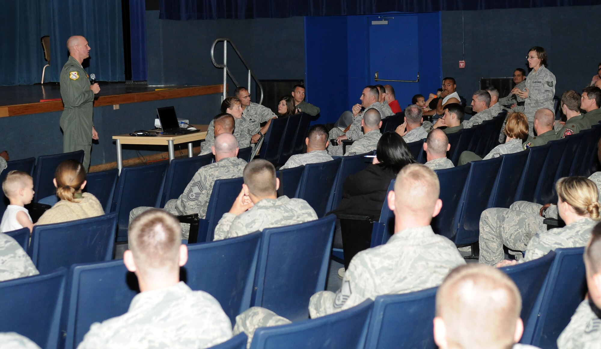 Brig. Gen. James Post listens to the question of a housing resident at a base town hall meeting July 7, 2011, Eielson Air Force Base, Alaska. After they were informed of base housing policies, attendees voiced their questions and concerns. General Post is the 354th Fighter Wing commander. (U.S. Air Force photo/ Airman 1st Class Janine Thibault)