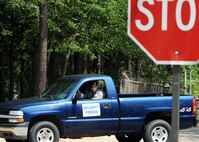 U.S. Air Force Staff Sgt. Adam Sacchetti, 20th Security Forces Squadron patrolman, performs stop sign checks at Shaw Air Force Base, S.C., to ensure safety July 12, 2011. The 20th SFS provide and enforce protection for Airmen of Shaw and its assets. (U.S. Air Force photo/Airman 1st Class Tabatha L. Duarte) (Released) 