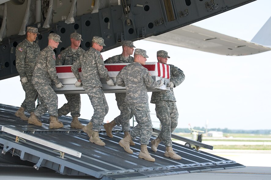 A U.S. Army carry team transfers the remains of Army Sgt. Steven L. Talamantez, of Laredo, Texas, at Dover Air Force Base, Del., July 13, 2011. Talamantez was assigned to the 3rd Battalion, 8th Cavalry Regiment, 3rd Brigade Combat Team, 1st Cavalry Division, Fort Hood, Texas. (U.S. Air Force photo/Steve Kotecki)
