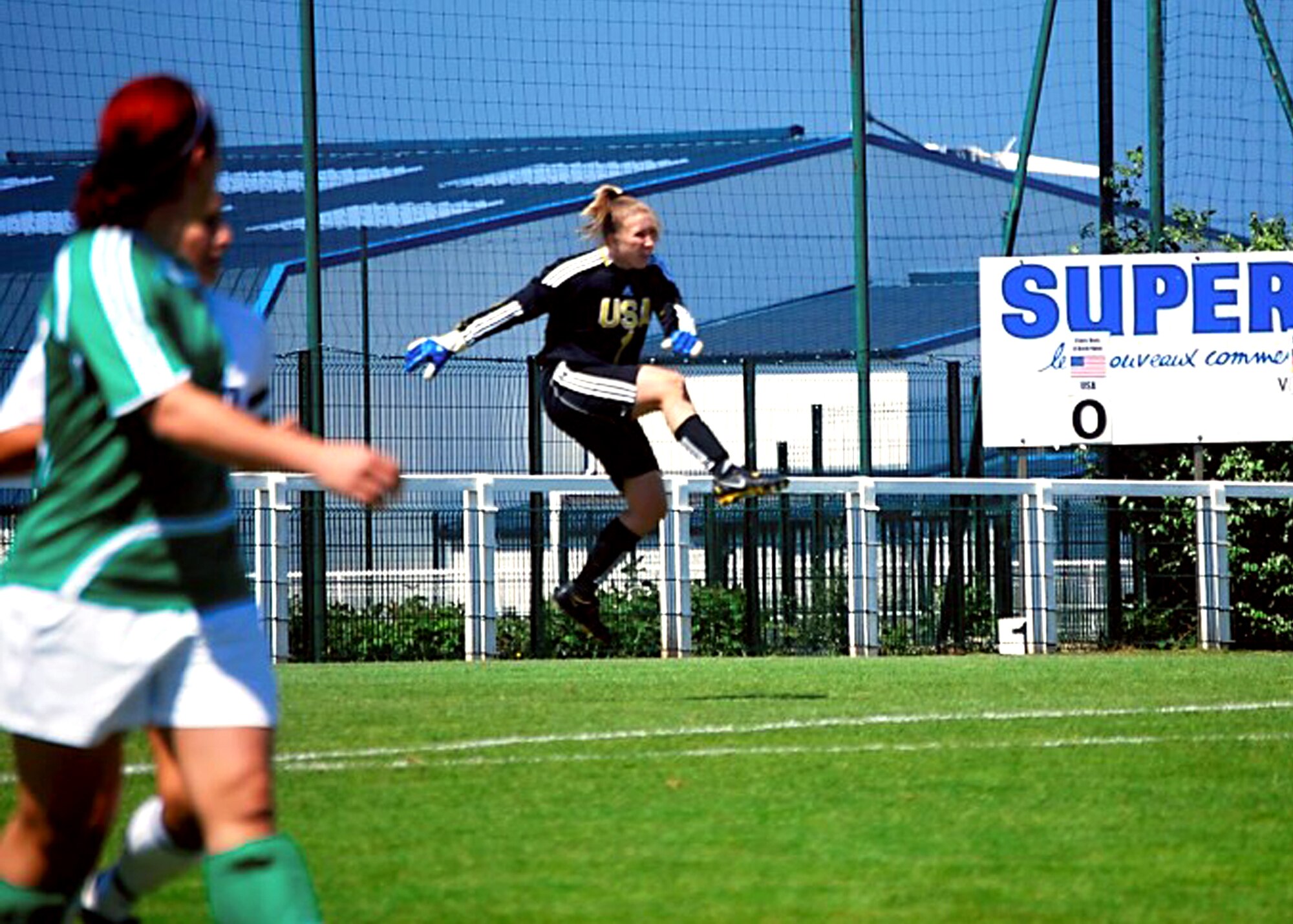 Redistributing the ball to her teammates, 1st Lt. Erin Wallace, 773rd Test Squadron, drop-kicks a soccer ball down the field in a soccer match against Germany last summer. For the second straight season, Wallace will play goalkeeper for the All-Armed Forces soccer team this July in Rio De Janeiro, Brazil for the 2011 Conseil International du Sport Militaire Military World Games. (Courtesy photo by Kevin Davalos)