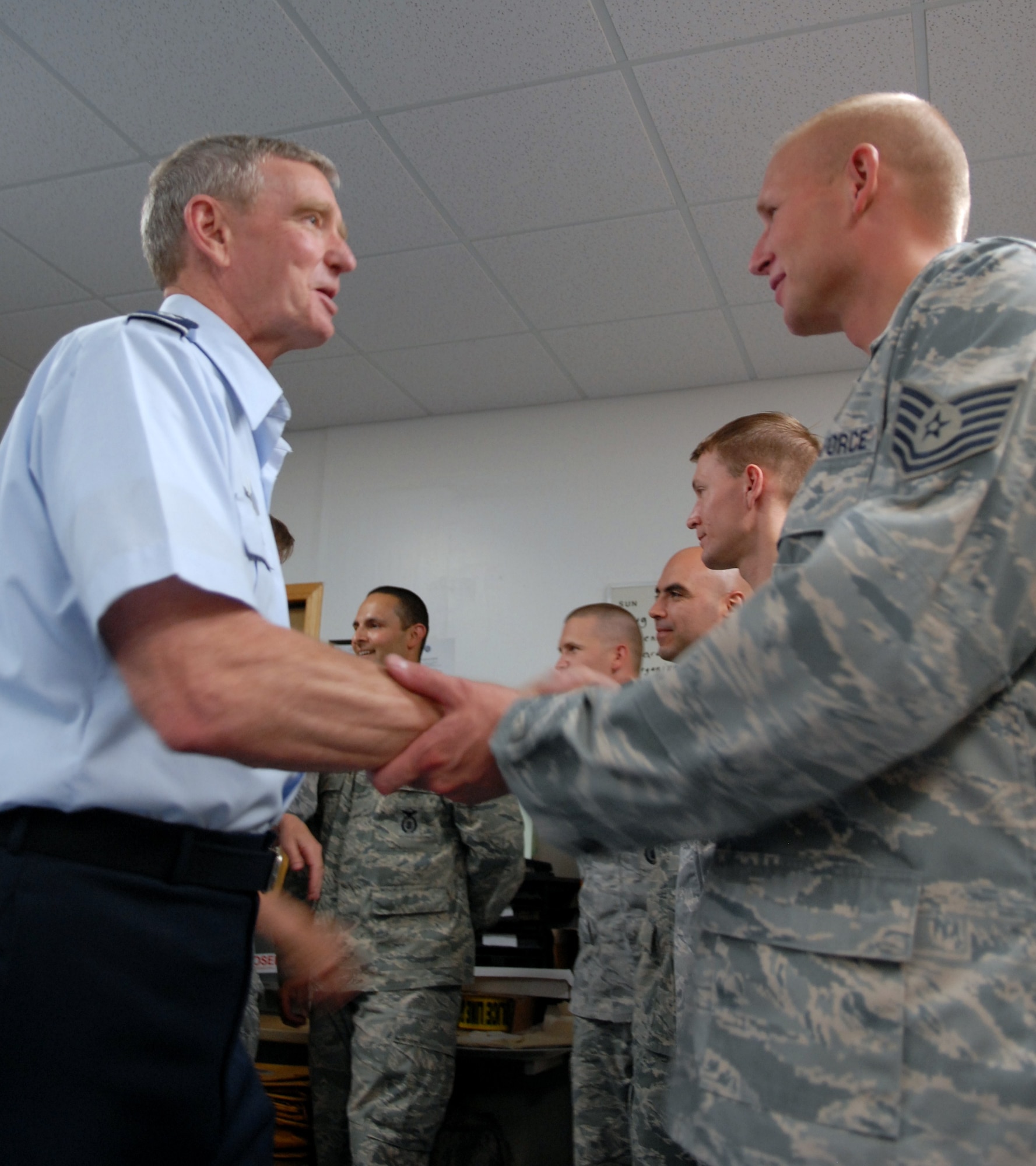 Brig. Gen. James Hogue, Air Force Flight Test Center mobilization assistant to the commander, welcomes back the 95th Security Forces Squadron Individual Mobilization Augmentee deployment team in Bldg. 3700 July 11. The team deployed for six months to Joint Base Ballad, Iraq, to perform air base defense. (Air Force photo by Kate Blais)
