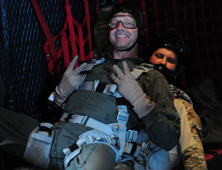 U.S. Air Force Col. Gary Henderson, 23rd Wing commander (front), and Tech. Sgt. Mark Panzera, 38th Rescue Squadron pararescueman, sit before conducting a tandem jump off of an HC-130P Combat King at Moody Air Force Base, Ga., July 12, 2011. The jump was part of Colonel Henderson’s fini-flight. (U.S. Air Force photo by Senior Airman Stephanie Mancha/Released)