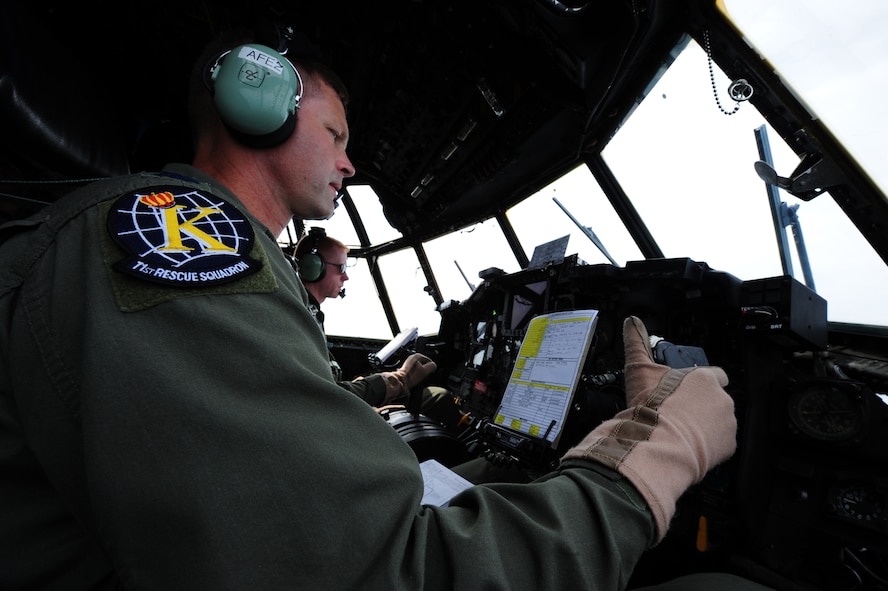 U.S. Air Force Col. Gary Henderson, 23rd Wing commander, flies an HC-130P Combat King along with Capt. Robert Allen, 71st Rescue Squadron C-130 pilot, for his fini-flight at Moody Air Force Base, Ga., July 12, 2011. Colonel Henderson is a command pilot with more than 4,400 flight hours. (U.S. Air Force photo by Senior Airman Stephanie Mancha/Released)