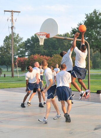 Six Airmen from the Joint Base Charleston - Air Base dormitories play three-on-three basketball during the Dorm Excellence Warrior Ethos challenge July 12 here. More than 50 Airmen participated in the challenge, created to boost morale and bring Airmen closer together. (U.S. Navy photo /Yeoman Third Class Timothy Daughton)
