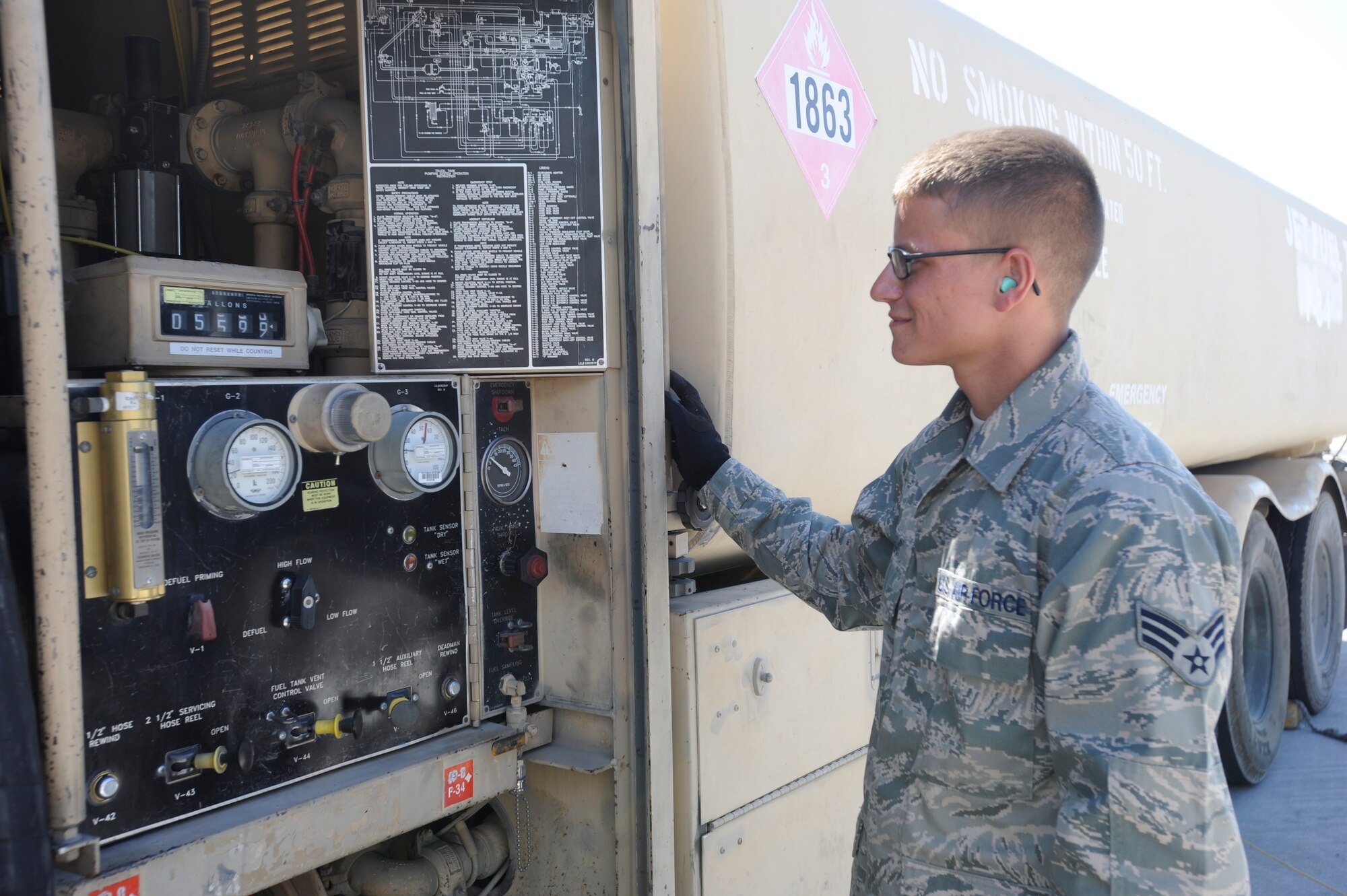 Senior Airman Chantz Wyant monitors how much fuel he is passing into a KC-135 Stratotanker at the Transit Center at Manas, Kyrgyzstan, July 11. While refueling this KC-135 Wyant achieved a deployment milestone when the gallons pumped tally reached 5,599 signaling he pumped more than 5 million gallons of JP8 during his time at the Transit Center. Wyant is a 376th Expeditionary Logistics Readiness Squadron fuels distribution operator deployed here from McConnell Air Force Base, Kan. He is a native of New Albany, Ohio. (U.S. Air Force photo/Tech. Sgt. Tammie Moore)