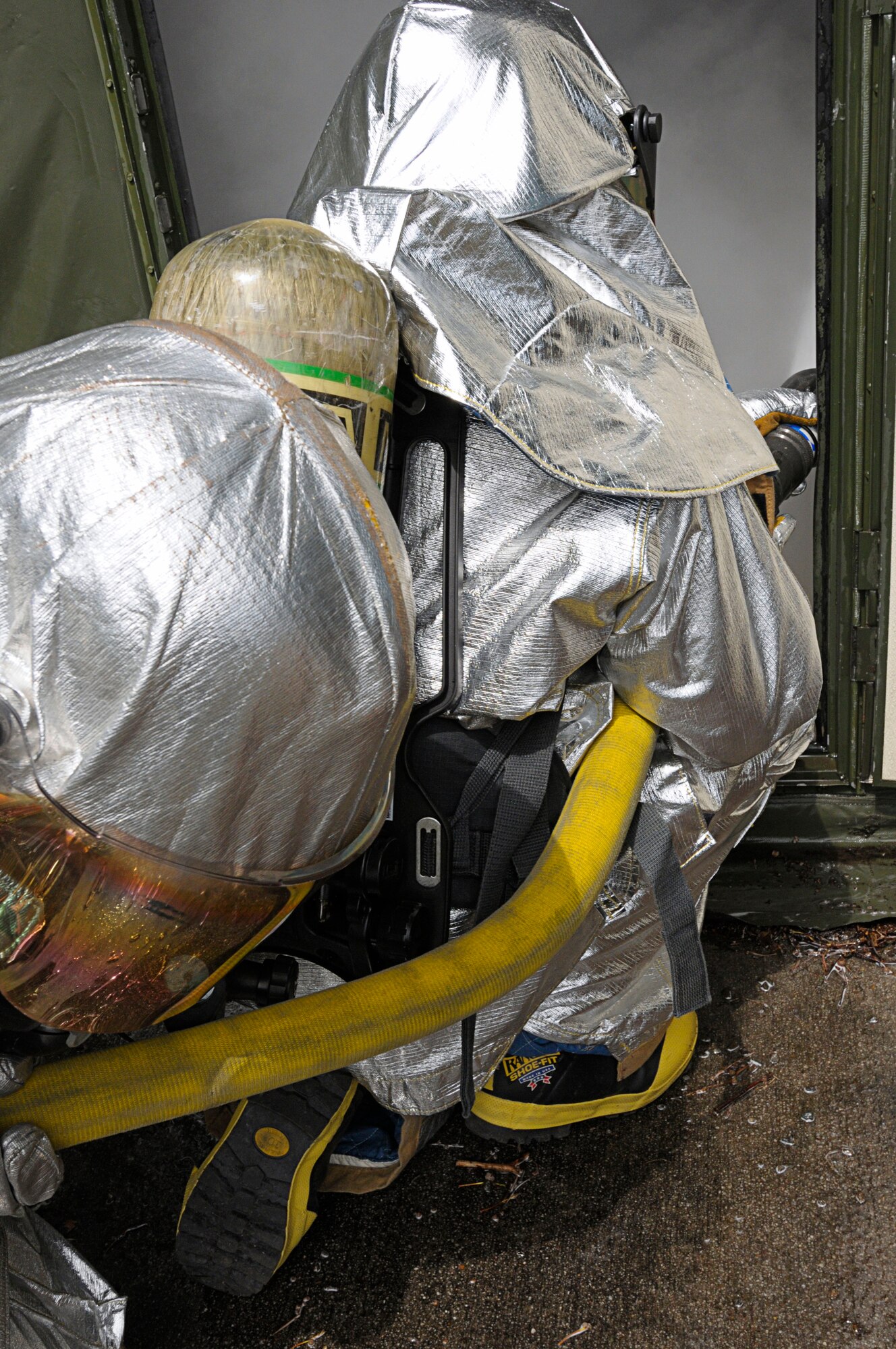 U.S. Air Force fire fighters respond to a simulated contained fire exercise during Silver Flag, Ramstein Air Base, Germany, July 12, 2011. The exercise inject consisted of several simulated scenarios that included victim rescue and uncontained fires. Silver Flag is a weeklong training program for Airmen from various bases; it combines classroom and practical application exercises to prepare Airmen for deployment. (U.S. Air Force photo by Airman 1st Class Desiree Esposito)