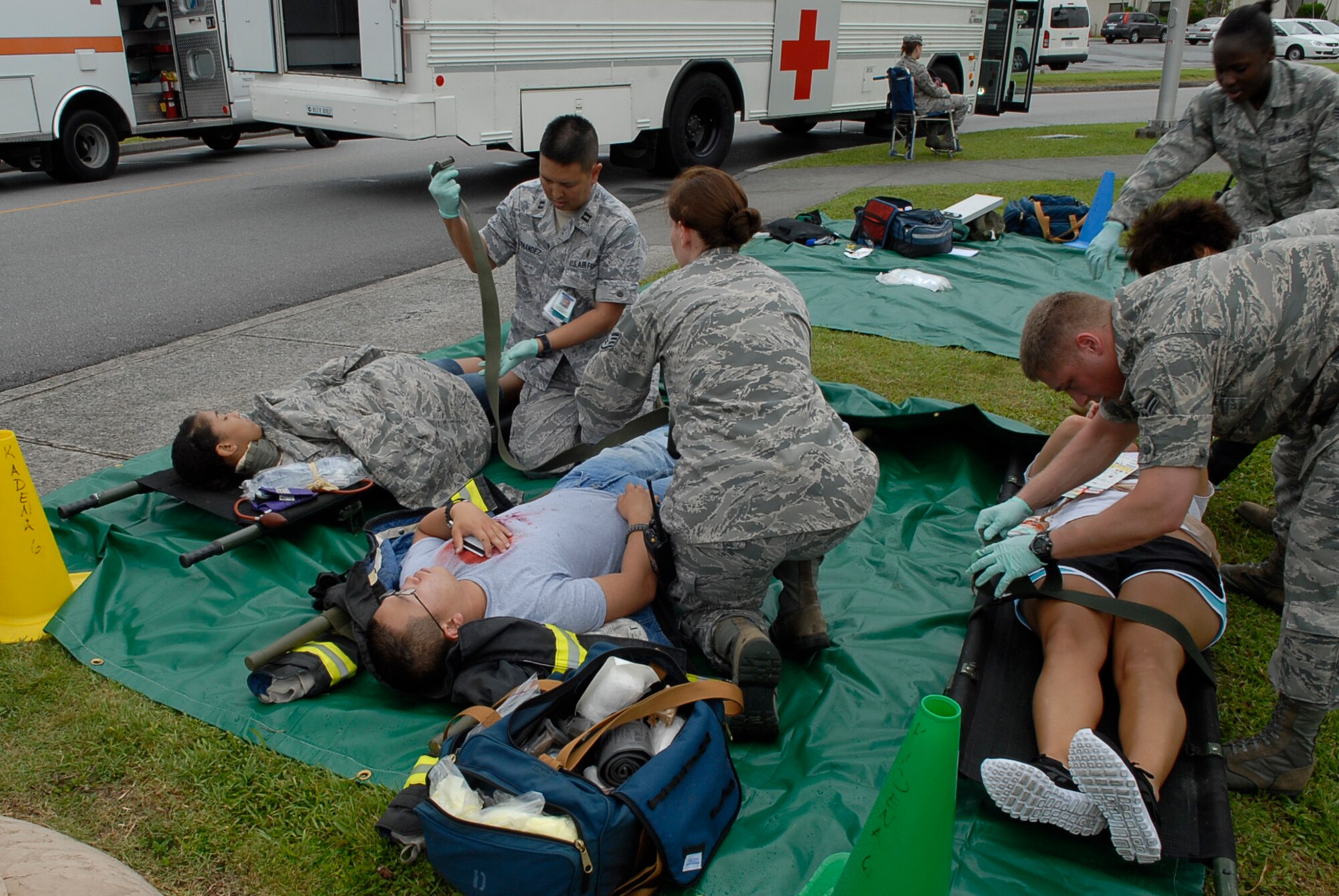 Responders from the 18th Medical Group secure victims of an active shooter scenario for transport July 13 during Beverly High 11-5, a Local Operational Readiness Exercise at Kadena Air Base, Japan. Scenarios provide hands-on training to prepare Kadena's Airmen for real-world contingencies. (U.S. Air Force photo/ Airman 1st Class Tara A. Williamson)