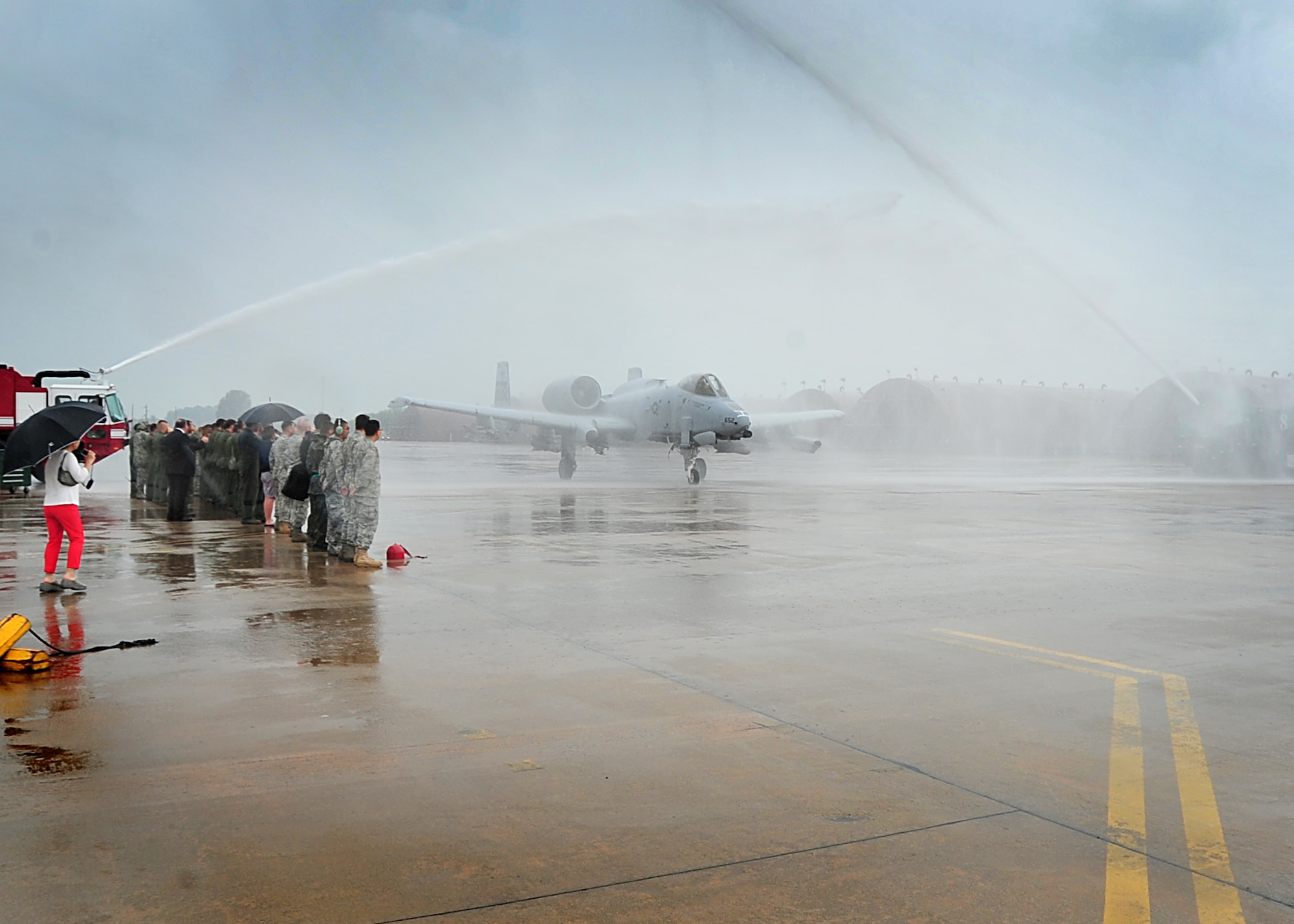 Col. Patrick Malackowski took his final flight as the 51st Fighter Wing commander here July 12.  Friends and family say farewell during the wing commander's last stroll down the flight-line.  Colonel Malackowski served as wing commander of the 51st FW since December 2009.  He and his family will depart Osan Air Base, Republic of Korea and head to Hickam Air Force Base, Hawaii, where he will become the 13th Air Force vice commander.  (U.S. Air Force Photos by/Staff Sgt. Daylena Gonzalez)