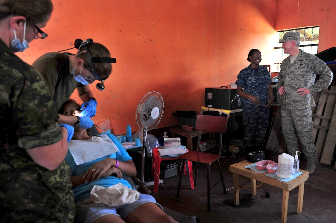 U.S. Air Force Gen. Douglas Fraser visits dental personnel during a Continuing Promise 2011 medical community service project at the Santa Isabel medical site in Puerto San Jose, Guatemala, July 7, 2011. Fraser is the commander of U.S. Southern Command. 