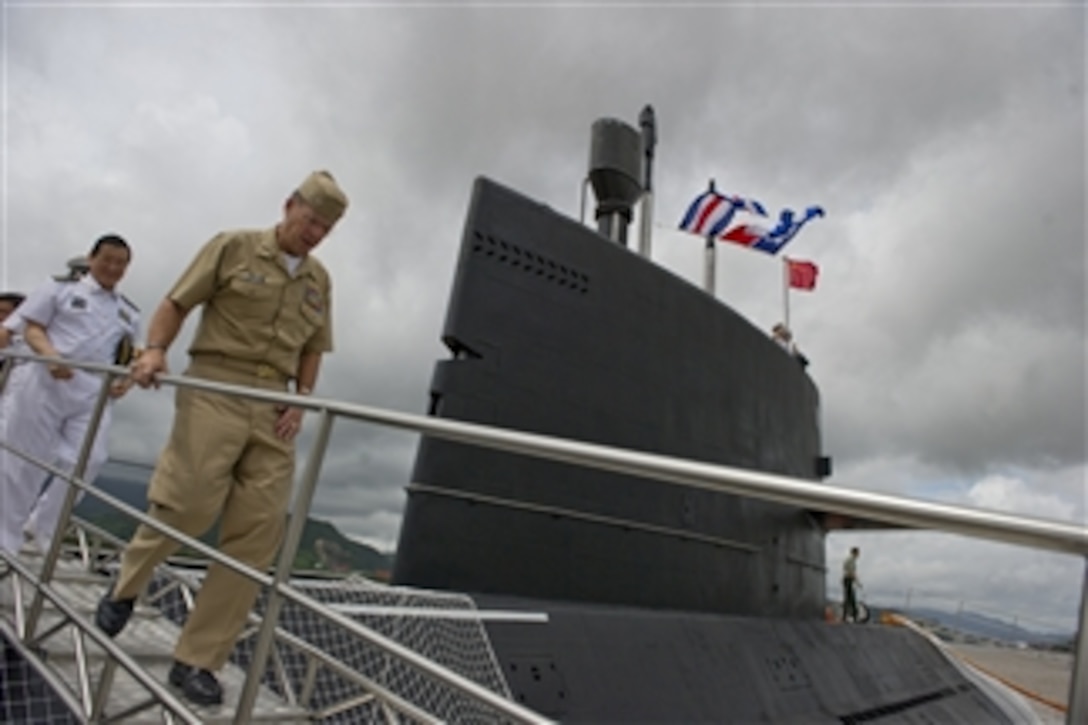 Chairman of the Joint Chiefs of Staff Adm. Mike Mullen departs the Chinese People's Liberation Army-Navy submarine Yuan at the Zhoushan Naval Base in China on July 13, 2011.  