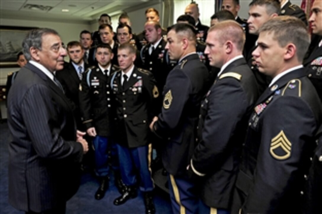 Defense Secretary Leon E. Panetta meets with Medal of Honor recipient Army Sgt. 1st Class Leroy Petry, center, and the 75th Ranger Regiment members with whom he served in Afghanistan in the secretary's Pentagon office, July 13, 2011. Panetta thanked the troops for their service and presented coins to each individual.