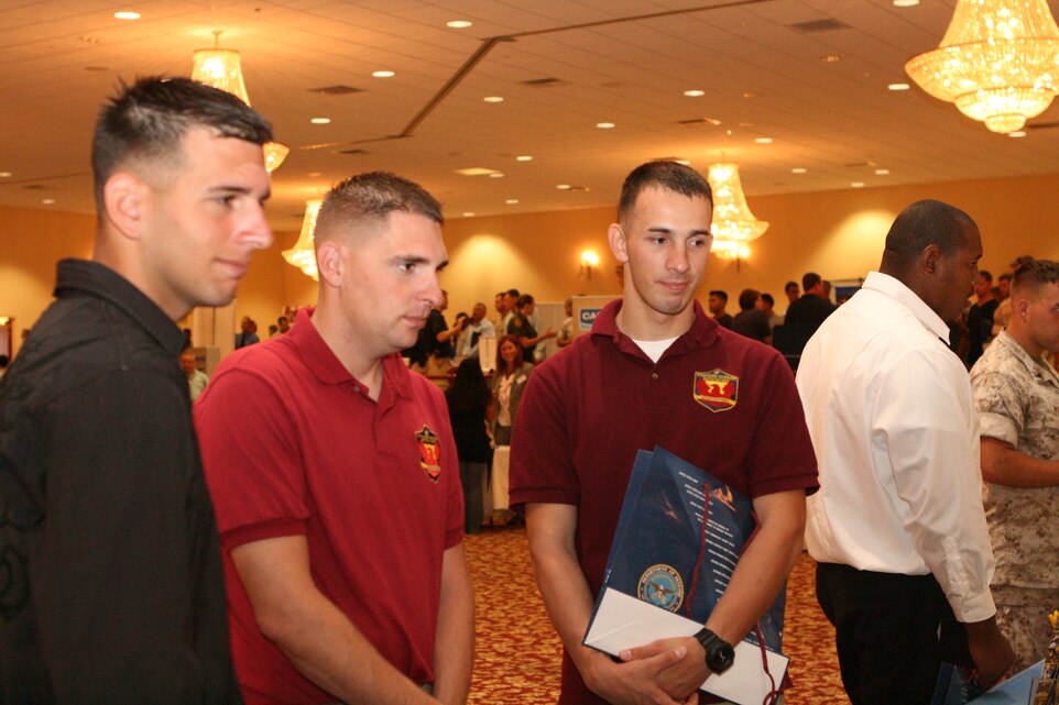 Lance Cpl. Martin Babich, Lance Cpl. John Lacy and Cpl. Christopher Rankin speak with employers during the Hiring Heroes Career Fair at the South Mesa Staff Noncommissioned Officers’ Club aboard Marine Corps Base Camp Pendleton, Calif., July 13.  The Hiring Heroes Career Fair is a part of the Department of Defense’s Civilian Personnel Management Service, Recruitment Assistance Division’s outreach program that provides specialized transition assistance to wounded, ill and injured service members whose careers have been cut short.