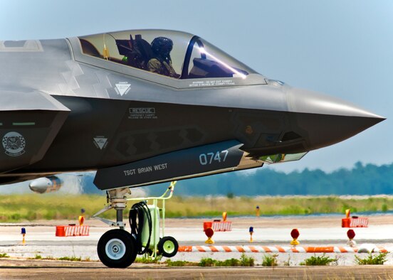 The Air Force’s first joint strike fighter pilot, Lt. Col. Eric Smith, of the 58th Fighter Squadron, taxis his squadron’s newest aircraft, the F-35 Lightning II, to its new home at Eglin Air Force Base, Fla., July 14.  (U.S. Air Force photo/Samuel King Jr.)