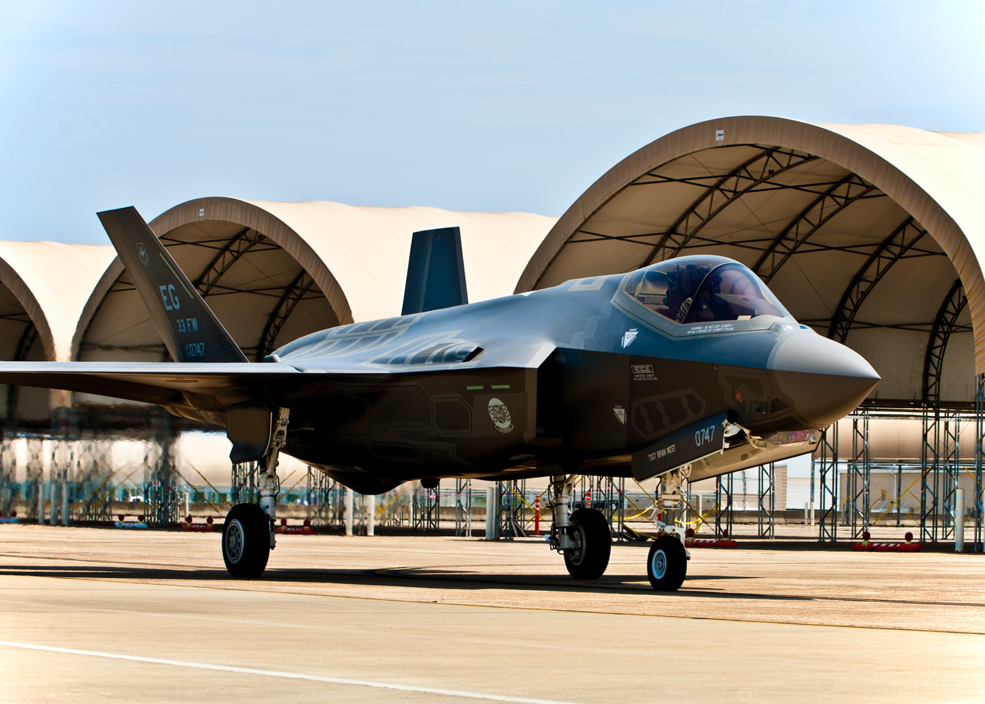 DoD's newest aircraft, the F-35 Lightning II joint strike fighter, taxis in to its new home, the 33rd Fighter Wing at Eglin Air Force Base, Fla., July 14.  (U.S. Air Force photo/Samuel King Jr.)