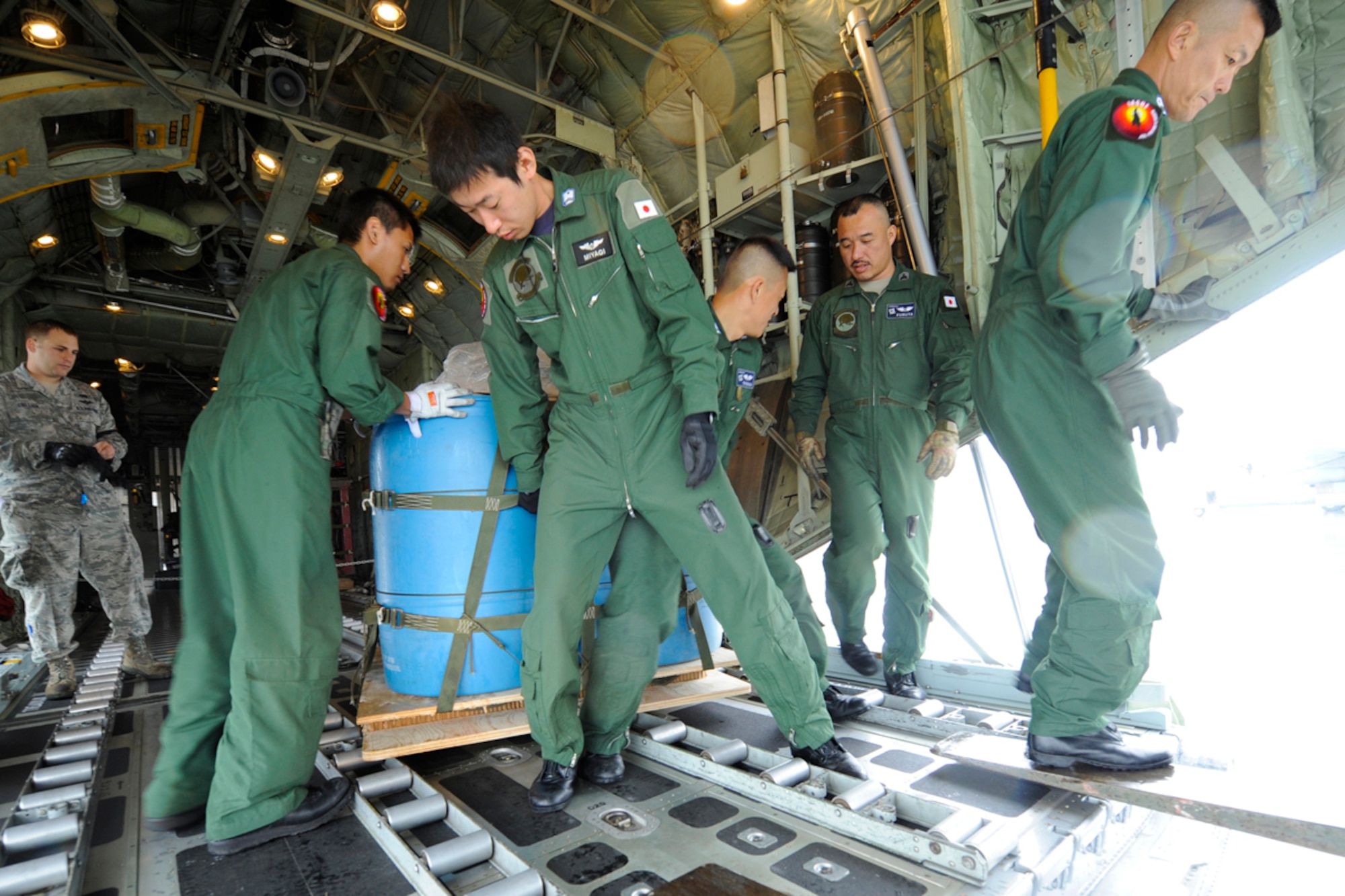 JOINT BASE ELMENDORF-RICHARDSON, Alaska -- Japanese Air Self-Defense Force air crew position a pallet which will later be paracute dropped during mission during a  multinational training exercise, Red Flag 11-2. (U.S. Air Force photo/Steve White)