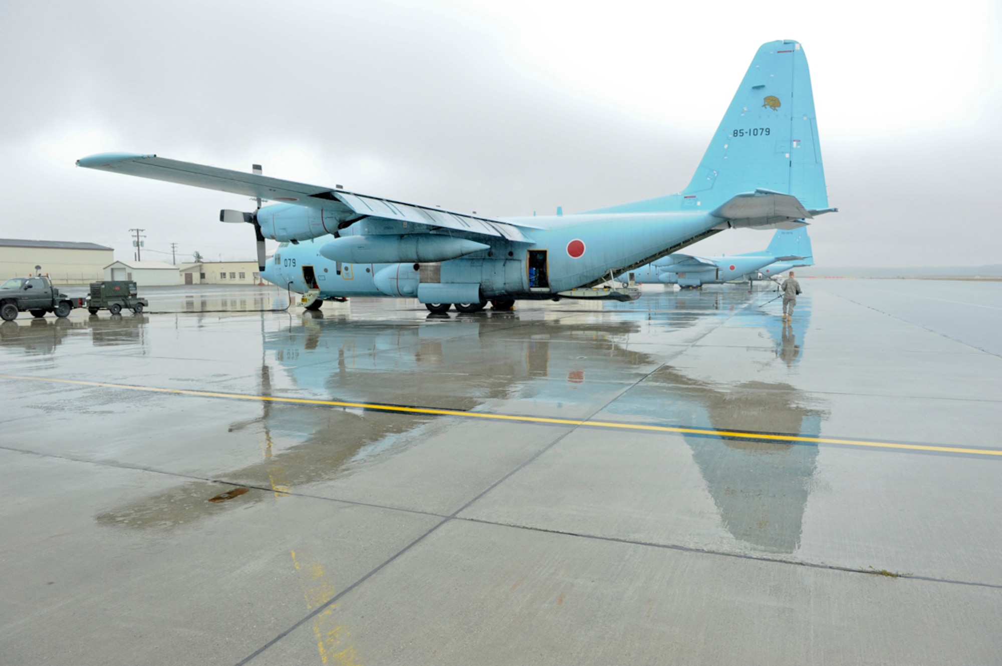 JOINT BASE ELMENDORF-RICHARDSON, Alaska -- Japanese Air Self-Defense Force C-130 Hercules cargo aircraft wait  for a load during a multinational training exercise, Red Flag 11-2. (U.S. Air Force photo/Steve White)