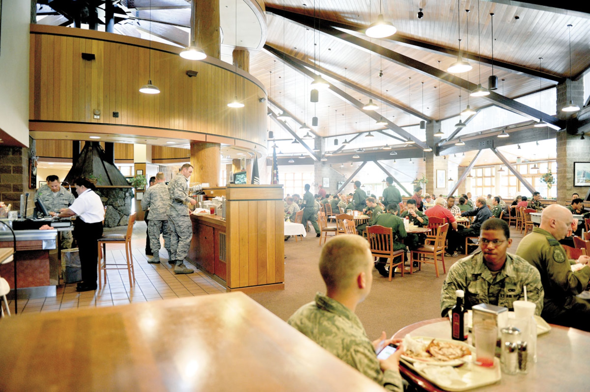 Patrons eat at the Iditarod Dining Facility, July 5. The Iditarod will close, Aug. 22, for renovations. Food operations will shift to the Kenai Dining Hall. (U.S. Air Force photo/Airman 1st Class Jack Sanders) 